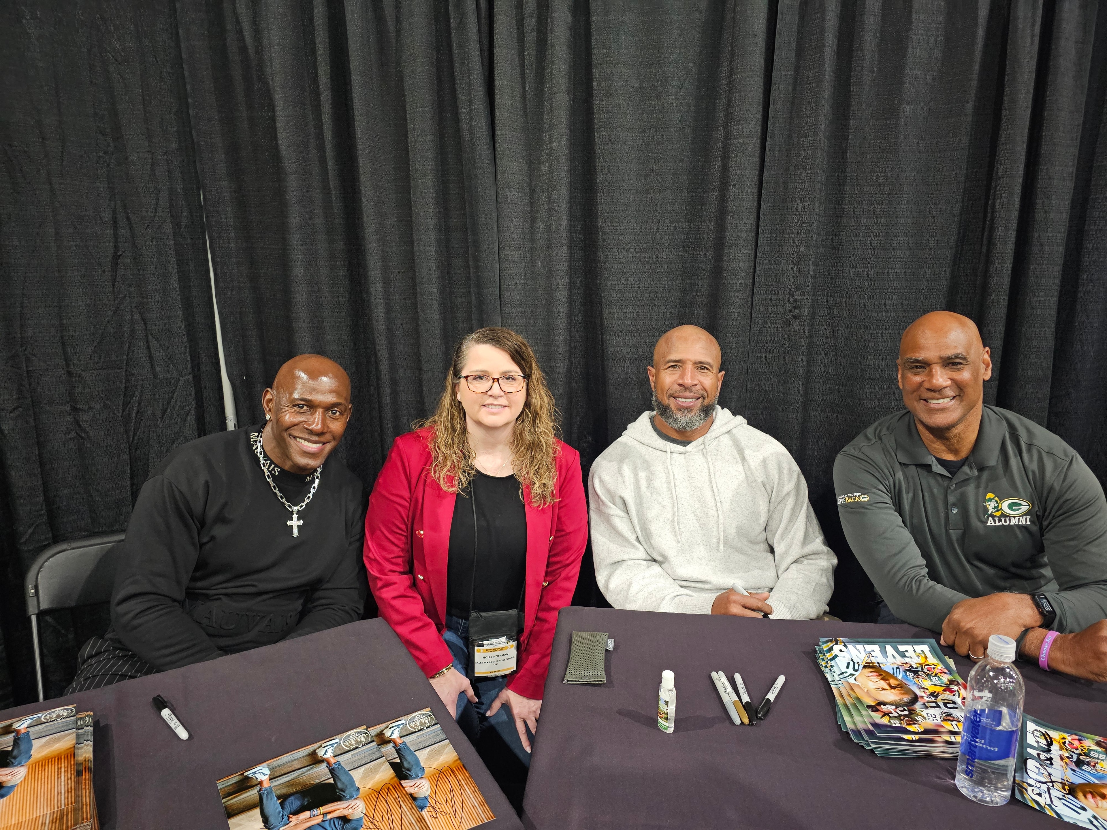 Holly with Green Bay Packers alumni at a signing event