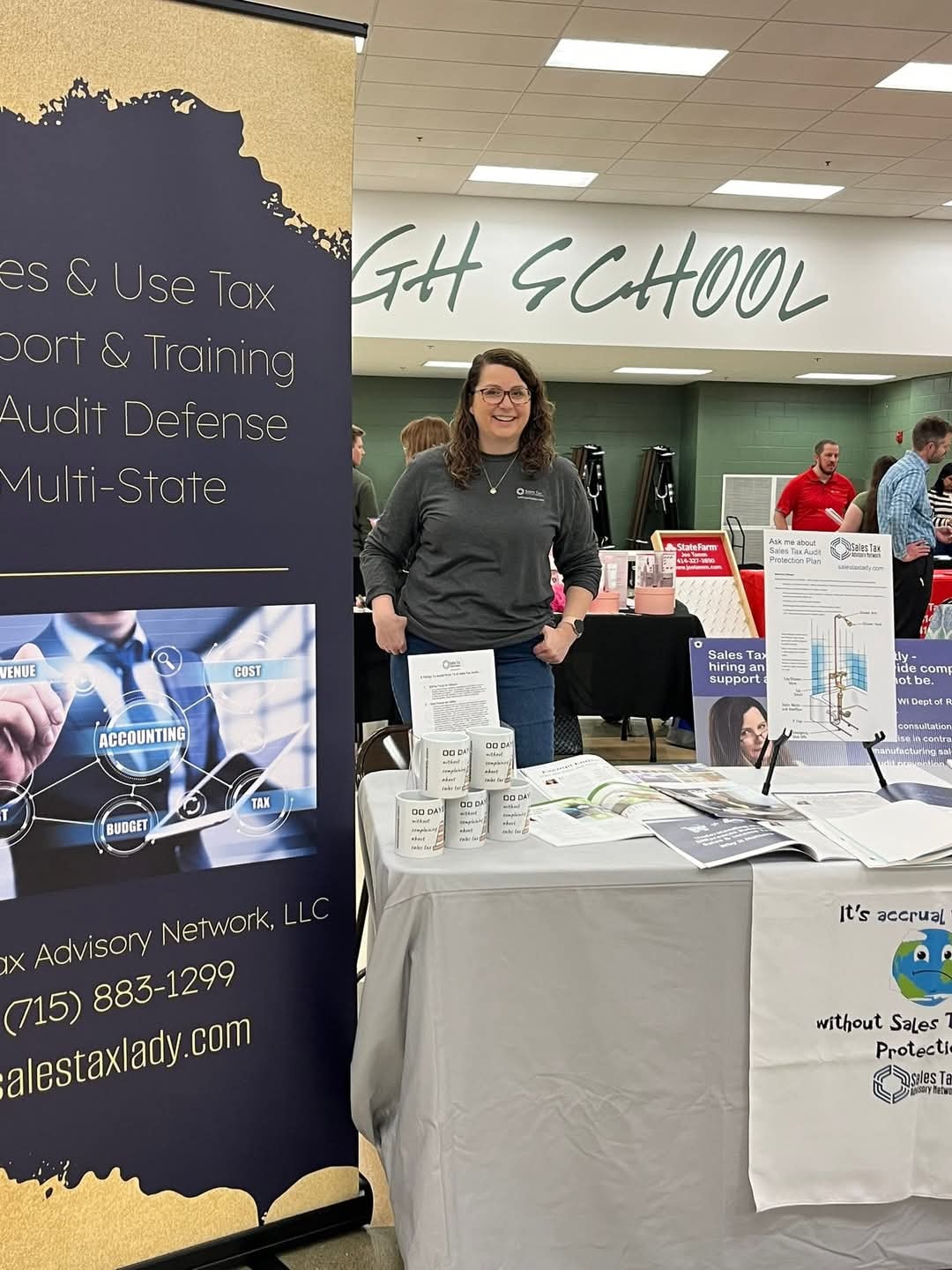 Holly at her Sales Tax Advisory Network trade show booth